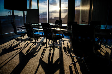 Silhouette meeting room of office in the evening at sunset