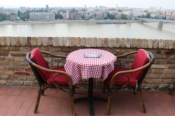 Table and two chairs in a cafe on the banks of the Danube River, Novy Sad, Serbia