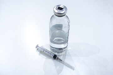 syringe and a bottle of vaccine. Medical concept vaccination hypodermic injection treatment.