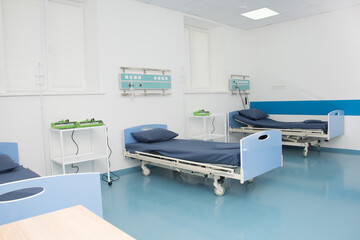 Empty modern hospital room for several patients. Modern medical equipment in the intensive care unit