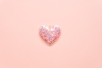 Valentine's day concept with pink heart on light background, top view, copy space.
