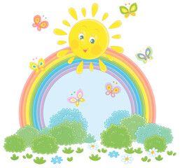 Naklejka premium Friendly smiling sun with a colorful rainbow and butterflies merrily flittering over a green field with flowers and green bushes after warm summer rain, vector cartoon illustration