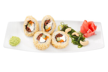 Japan appetizing sushi rolls on a white plate isolated on a white background. Restaurant serving concept.
