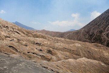 Solidified lava texture. Hills of volcanic origin. Abstract natural background. Surface of the earth after a volcanic eruption.