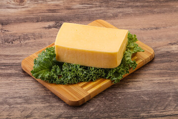 Tasty yelloow Tilsiter cheese brick