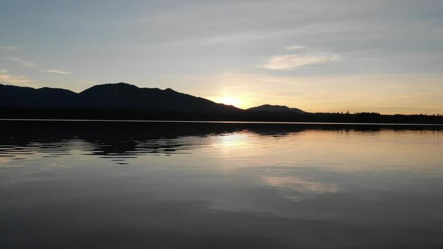 Staffelsee lake in Germany Bavaria recorded in the afternoon twilight flying over the lake with a DJI drone in 4k with ND filters