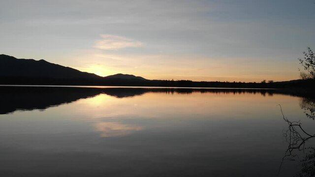 Staffelsee lake in Germany Bavaria recorded in the afternoon twilight flying over the lake with a DJI drone in 4k with ND filters