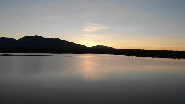 Staffelsee lake in Germany Bavaria recorded in the afternoon twilight flying over the lake with a DJI drone in 4k with ND filters