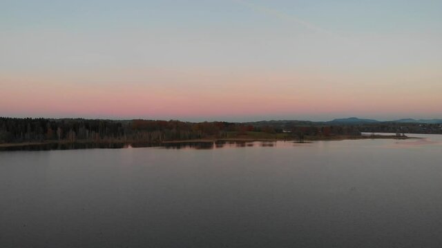 Staffelsee lake in Germany Bavaria recorded in the afternoon twilight flying over the lake with a DJI drone in 4k with ND filters