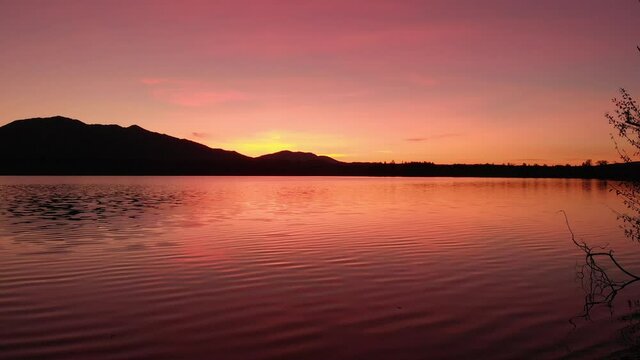 Staffelsee lake in Germany Bavaria recorded in the afternoon twilight flying over the lake with a DJI drone in 4k with ND filters
