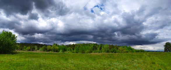 Before the rain. Idyllic rural scene. Atmospheric spring landscape.