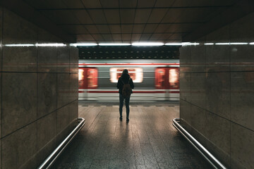 Woman waiting for the metro in Prague, Czech Republic.
