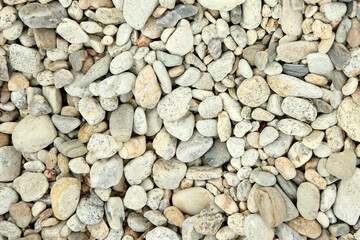 Naklejka premium background of stones on the beach