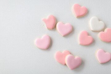 pink heart sugar cookies on white background, flatlay