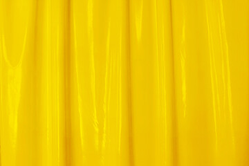 Yellow smooth glossy abstract elegant liquid background. Latex, lacquer, varnish wave.