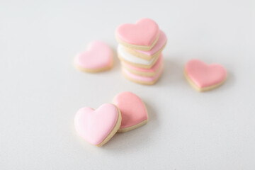 pink heart sugar cookies on white background, soft focus, shallow depth of field