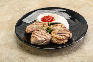 Grilled pork tenderlion with tomato sauce