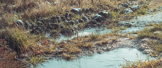 First snow and frost on a dirt road
