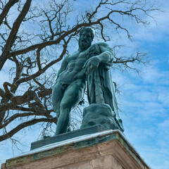 bronze sculpture of the god of war against a blue winter sky in the park of the city of Pushkin near St. Petersburg, Russia
