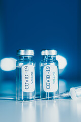 COVID-19 coronavirus vaccine. Ampoule and syringe close-up. Concept