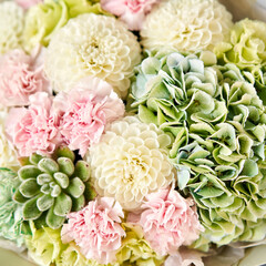 Beautiful bouquet of mixed flowers in woman hand. Floral shop concept . Handsome fresh bouquet. Flowers delivery.