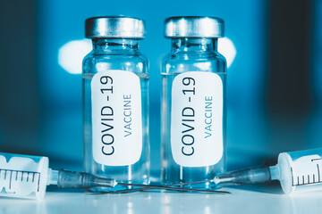 COVID-19 coronavirus vaccine. Ampoule and syringe close-up. Concept