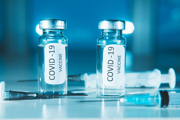 COVID-19 coronavirus vaccine. Ampoule and syringe close-up. Concept
