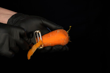 Naklejka premium the process of cleaning fresh carrots
