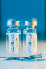 COVID-19 coronavirus vaccine. Ampoule and syringe close-up. Concept