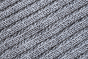 Seamless knitted fabric. Knitted sweater, plaid, scarf. Knitted background