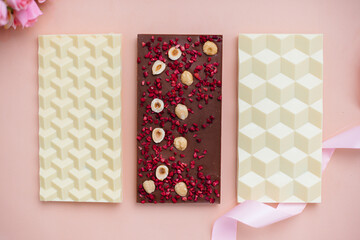 Natural handmade chocolate close-up on a bright background.