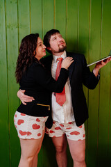 a cheerful couple in shorts and jackets are broadcast live. online conference.