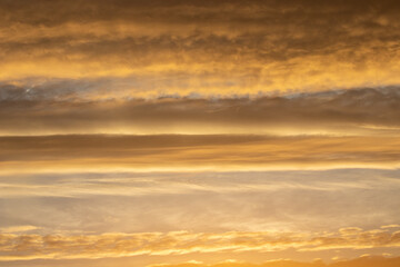 Sunrise with orange sky and colourful clouds