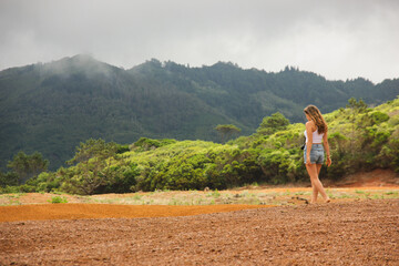 Girl walking in Barreiro da Faneca, Santa Maria island, desert, Azores.