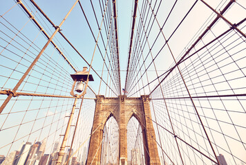 Wide angle picture of Brooklyn Bridge in the morning, color toning applied, New York City, USA.