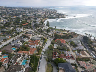 Aerial view of the the sea with cliff in La Jolla Hermosa town during gray day, San Diego, California, USA