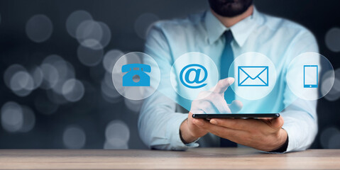 man holding phone with communication icons