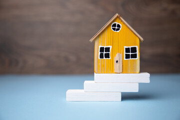 house model on wooden blocks