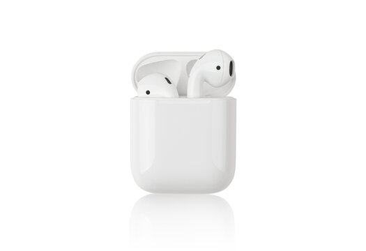 Rostov-on-Don, Russia - December 2019. Apple AirPods on a white background. Wireless headphones in a charging case close-up.