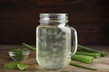 Fresh aloe drink in mason jar on wooden table