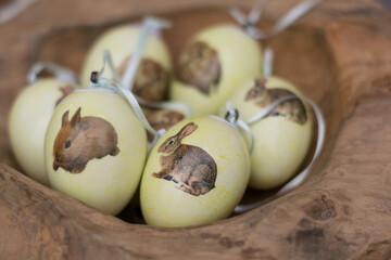 Colored Easter Eggs With The Symbol Of The Easter Bunny Lying In A Wooden Bowl