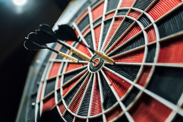 Red and black dartboard with darts