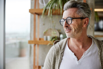 Mature man wearing eyeglasses looking away