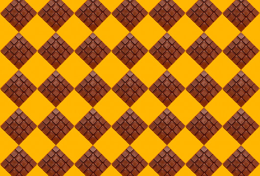 Pattern of chocolate bars against yellow background