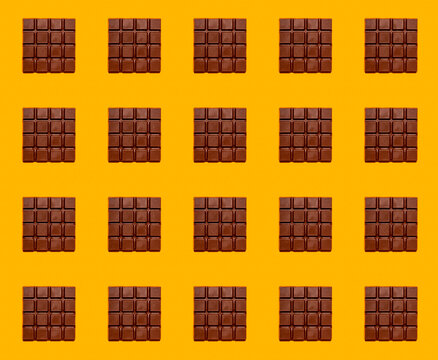 Pattern of chocolate bars against yellow background