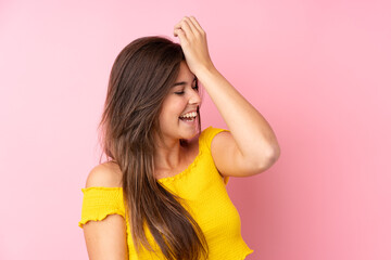 Teenager Brazilian girl over isolated pink background has realized something and intending the solution