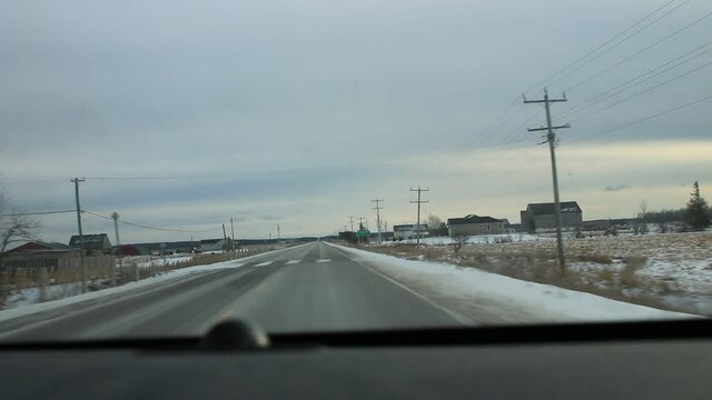 Winter driving in Ontario Canada, rocky road conditions 