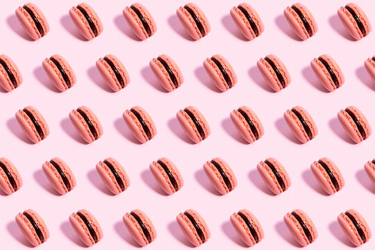 Pattern Of Pink Macaroon Cookies Against Pink Background