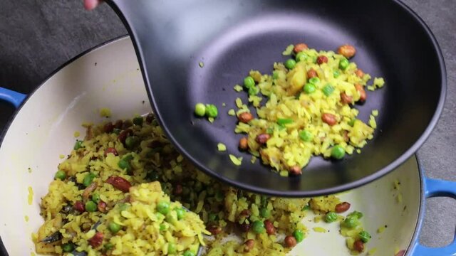 Plating Batata and Kanda Poha or Potato, Onion Poha, a Maharashtrian snack dish.