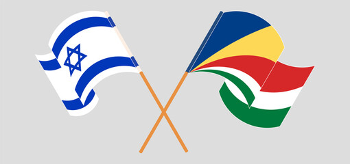 Crossed and waving flags of Israel and Seychelles